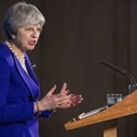 British PM Theresa May marks historic women's vote but warns of online abuse